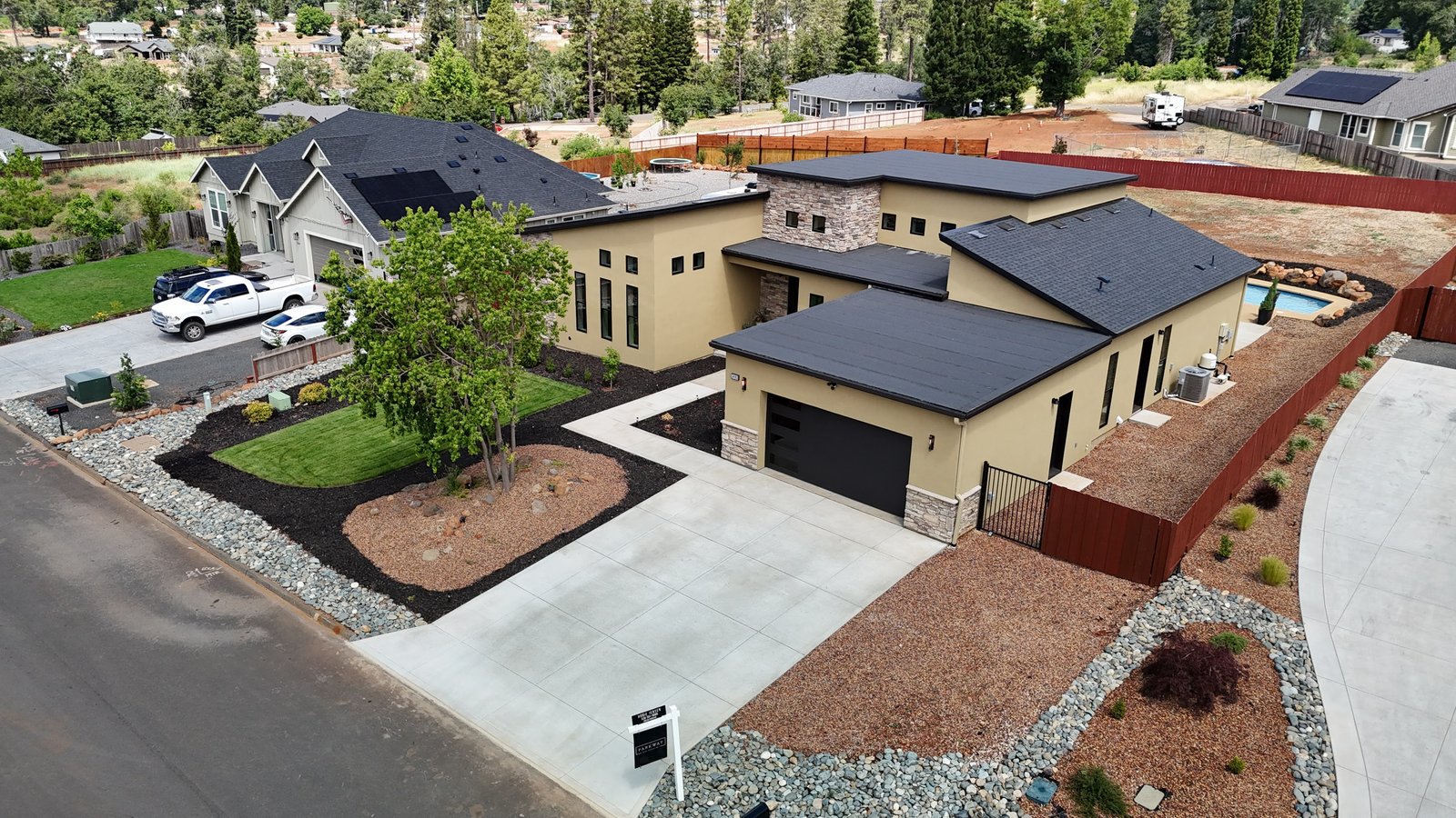 Aerial view of 5093 Malibu Drive with pool visible