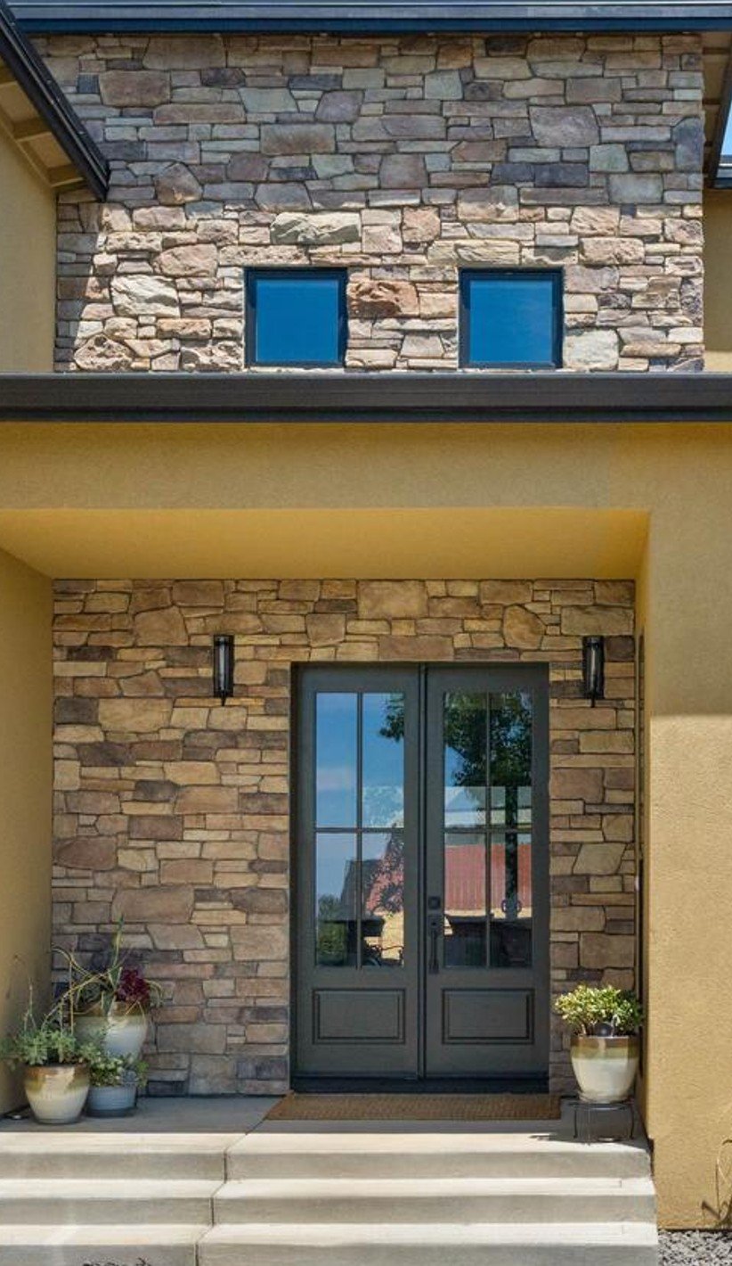 Front entry double doors with stone facade